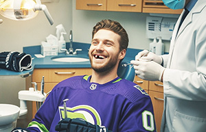 image of hickey player with broken tooth in dentist chair - Lakeside Dental St. Catharines Ontario